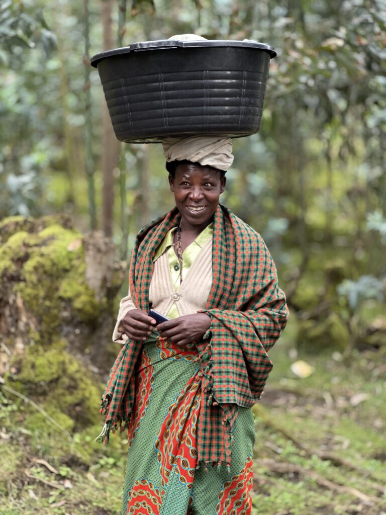 A woman carrying a basket on her head.