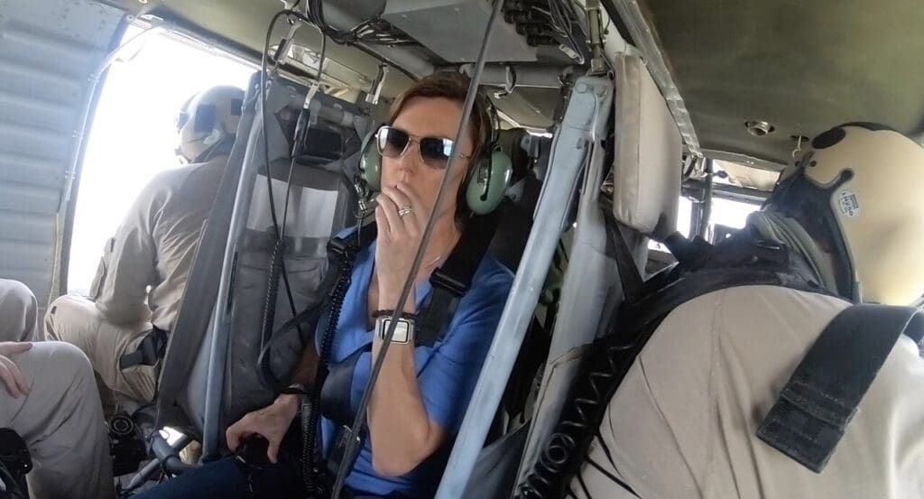 A woman in the cockpit of an airplane.